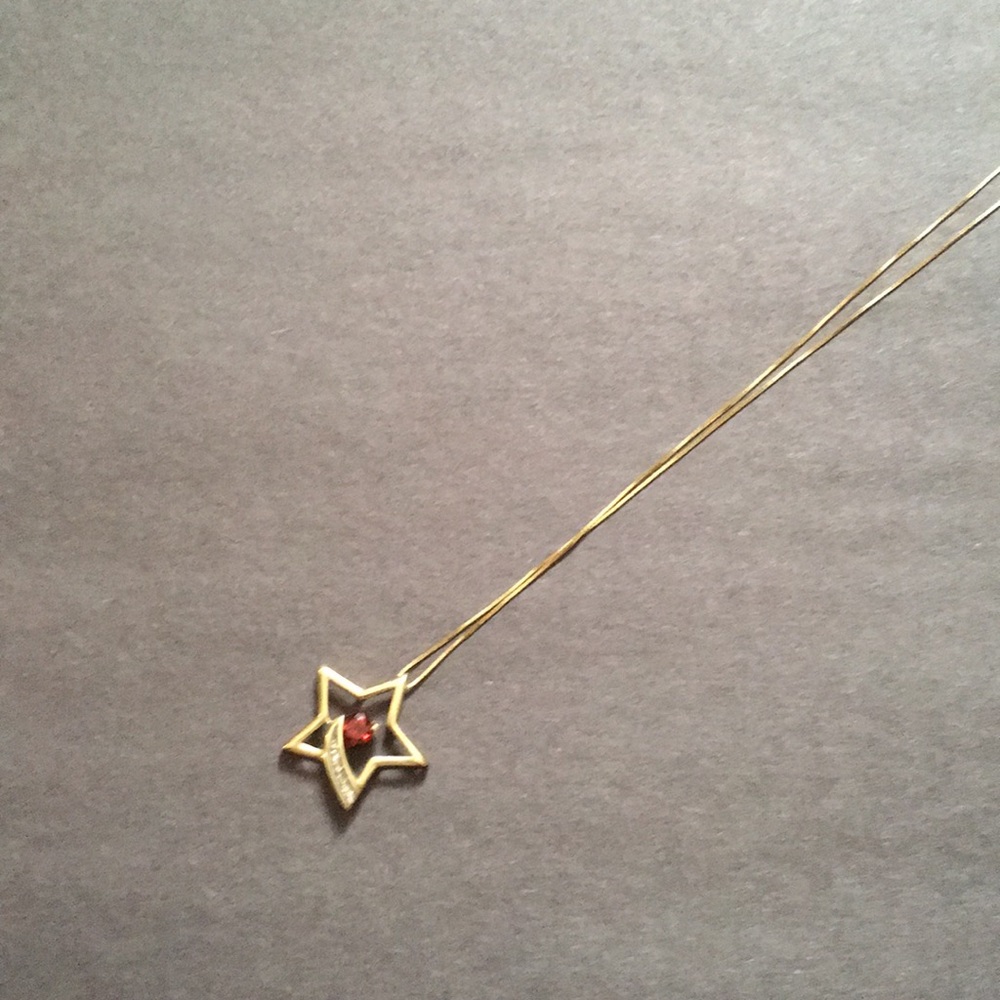 Gold Star Necklace with Red Gemstone